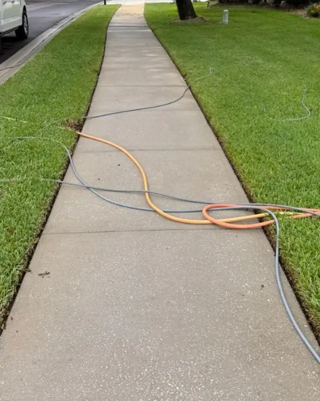 Concrete sidewalk in Melbourne, FL after pressure washing
