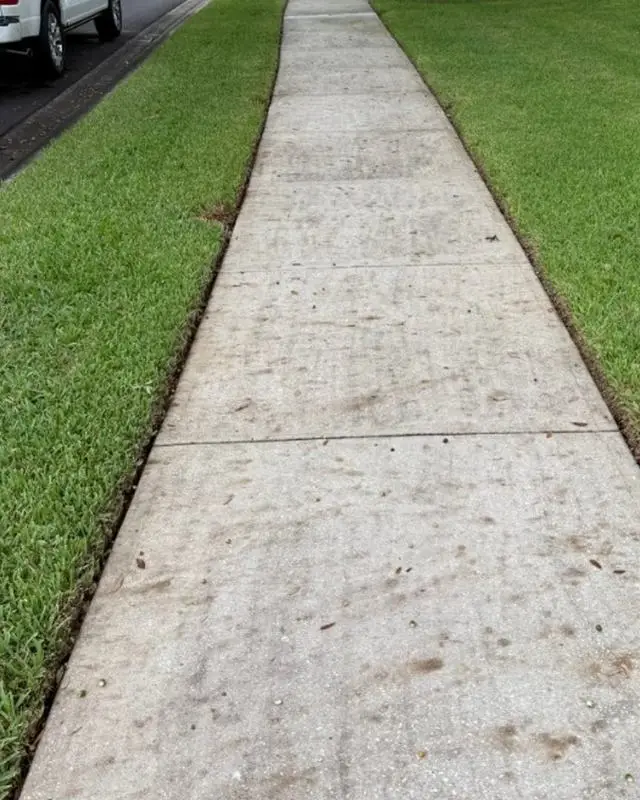 Concrete sidewalk in Melbourne, FL before pressure washing