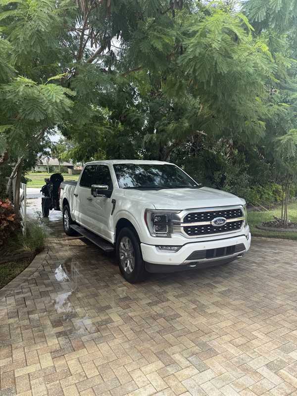 Pressure Washing by Brandon truck parked on a cleaned paver driveway in Rockledge, FL