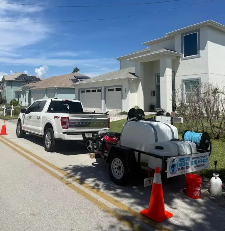 Pressure Washing by Brandon truck and wash trailer at a Rockledge, FL home